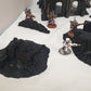 terrain scenery in black can be used for any minuture gaming 2 buildings 3 sandbags 1 wreaked rhino 2 wreaked dreadnought ruins